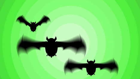 Animation-Von-Drei-Schwarzen-Fledermäusen,-Die-über-Grüne-Konzentrische-Ringe-Fliegen