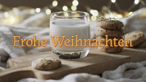 Frohe-weihnachten-text-in-orange-over-christmas-cookies-and-milk-with-bokeh-lights