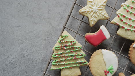 Video-of-christma-cookies-decorated-sugar-icing-with-copy-space-on-grey-background