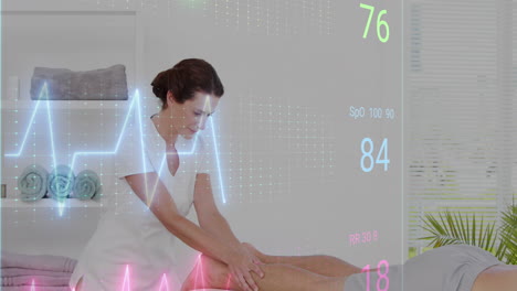 Animation-of-heart-rate-monitor-over-caucasian-female-physiotherapist-giving-a-massage-to-man