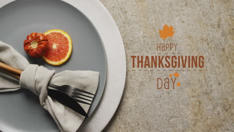 Animation-of-happy-thanksgiving-day-text-over-place-setting