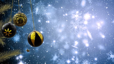 Swinging-black-and-gold-christmas-baubles-over-glowing-snowflakes-and-falling-snow