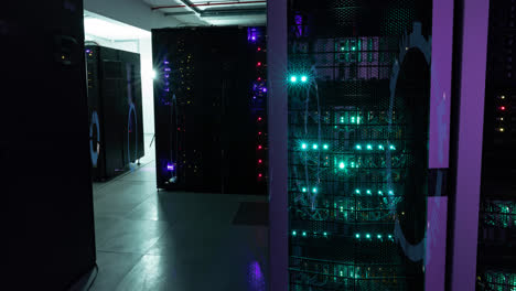 Animation-of-moving-circles-forming-tunnel-over-illuminated-server-room-in-background