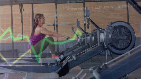 Animation-of-data-on-graph-over-biracial-woman-training-on-rowing-machine-at-gym