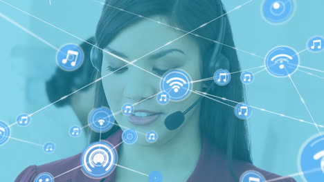 Animation-of-network-of-digital-icons-against-biracial-woman-talking-on-phone-headset-at-office