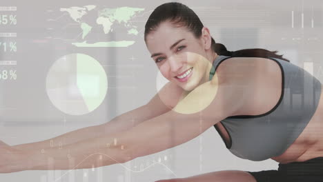 Animation-of-data-processing-over-caucasian-fit-woman-showing-thumbs-up-while-stretching-at-the-gym
