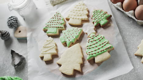Video-of-christma-cookies-decorated-with-green-sugar-icing-with-copy-space-on-white-background