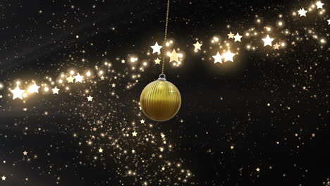 Swinging-gold-christmas-baubles-over-glittering-shooting-star-on-dark-background