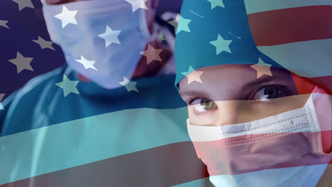 Animation-of-flag-of-usa-over-diverse-doctors-wearing-face-masks