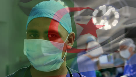 Animation-of-waving-algeria-flag-over-portrait-of-biracial-male-surgeon-in-surgical-mask-at-hospital