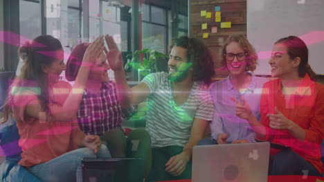 Animation-of-neon-lights-moving-over-diverse-female-and-male-coworkers-in-office