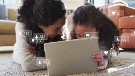 Animation-of-social-media-notifications-over-happy-caucasian-mother-and-daughter-using-tablet