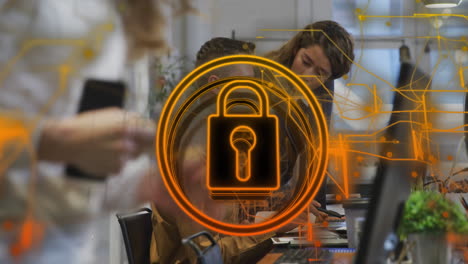 Animation-of-security-padlock-icon-against-diverse-man-and-woman-discussing-at-office