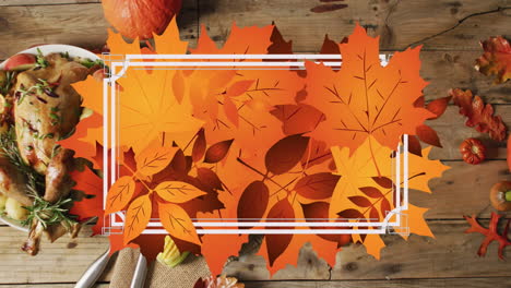 Animation-of-white-frame-and-autumn-leaves-over-thanksgiving-dinner-background