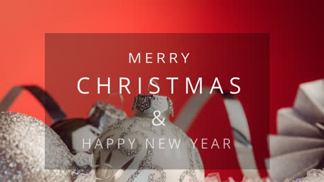Animation-of-merry-christmas,-happy-new-year-text-and-baubles-against-red-background