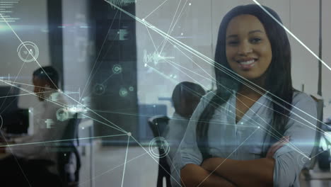 Animation-of-network-of-connections-against-portrait-of-african-american-woman-smiling-at-office