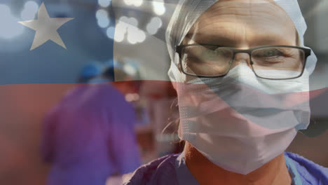 Animation-of-chile-flag-over-portrait-of-caucasian-female-surgeon-in-surgical-mask-at-hospital