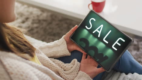Caucasian-woman-using-tablet-at-home-online-shopping-during-sale,-slow-motion