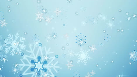 Animation-of-stars-and-snowflake-icons-falling-against-blue-gradient-background-with-copy-space