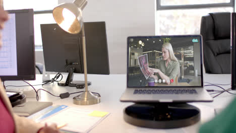 Laptop-with-video-call-with-caucasian-businesswoman-on-screen