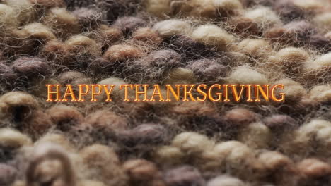 Animation-of-happy-thanksgiving-text-over-wool-pattern-background