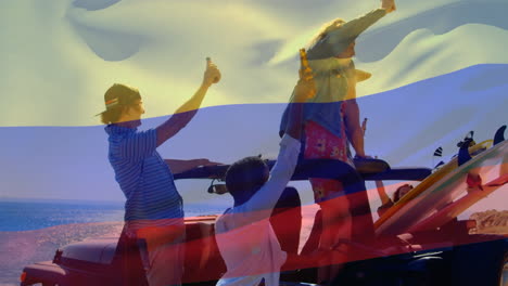 Composite-video-of-waving-colombia-flag-over-group-of-diverse-friends-toasting-beers-in-the-car