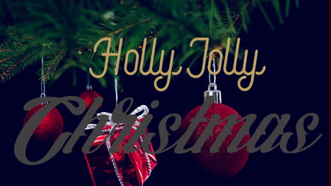Animation-of-holly-jolly-christmas-text-banner-against-hanging-baubles-and-gifts-on-a-branch