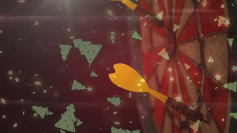 Animation-of-multiple-christmas-tree-icons-falling-over-close-up-of-a-yellow-arrow-on-dart-board