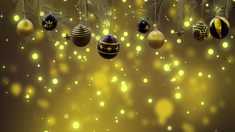 Christmas-tree-with-swinging-black-and-gold-baubles-over-yellow-bokeh-and-light-spots,-copy-space