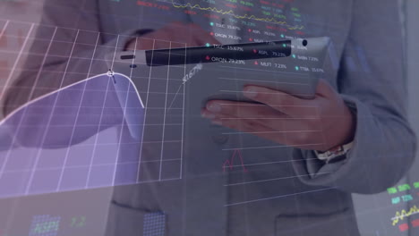 Animation-of-stock-market-data-processing-over-mid-section-of-businessman-using-tablet-at-office