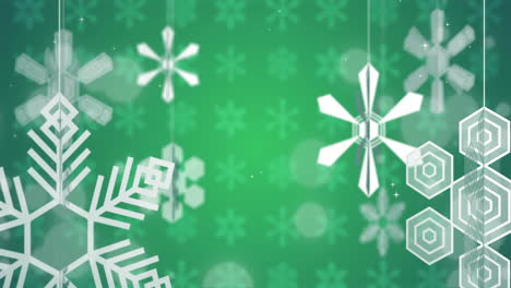 Animation-of-white-snowflakes-spinning-on-green-background