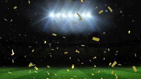 Animation-of-golden-confetti-falling-against-sports-field-and-floodlights