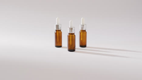 Close-up-of-dropper-serum-bottles-on-white-background-with-copy-space