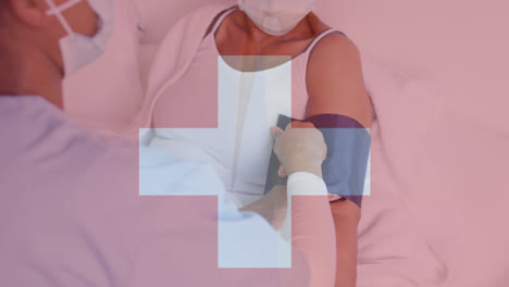 Animation-of-flag-of-switzerland-over-diverse-doctor-and-patient-wearing-face-masks