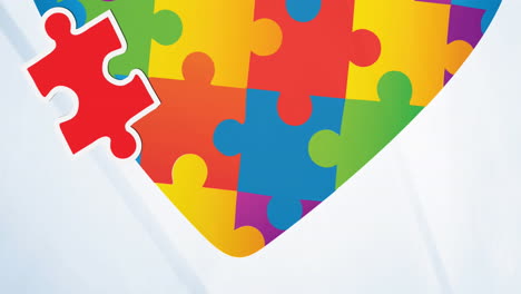 Animation-of-autism-awareness-month-puzzle-pieces-and-heart-on-white-background