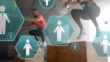 Animation-of-people-icons-floating-over-diverse-man-and-woman-jumping-on-boxes-cross-training-at-gym