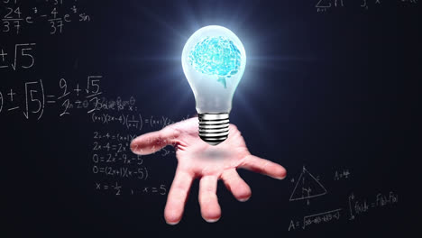 Animation-of-bulb-with-brain-over-caucasian-man-hand-and-math-formulas-on-black-background