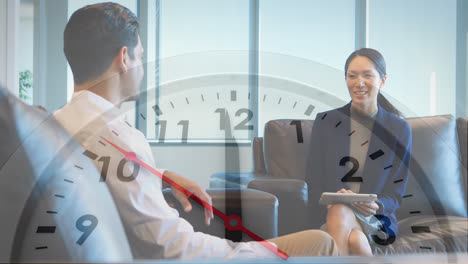 Animation-of-clock-over-two-diverse-business-people