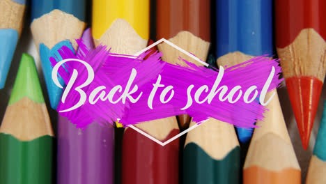 Animation-of-back-to-school-text-over-coloured-pencils