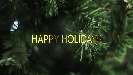Happy-holidays-text-in-gold-over-close-up-christmas-tree-background