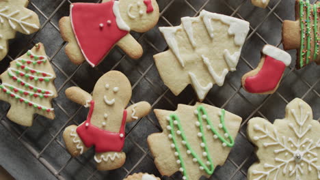 Video-of-christma-cookies-decorated-sugar-icing-with-copy-space-on-grey-background