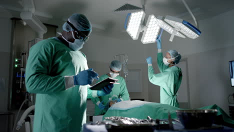 Surgeons-in-an-operating-room,-focused-on-a-procedure-in-a-hospital