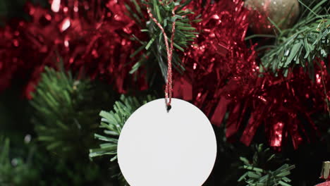 Video-of-christmas-tree-with-decorations-and-tag-with-copy-space