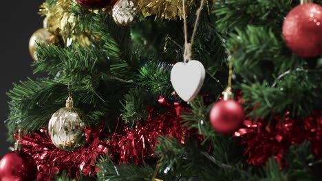 Video-of-christmas-tree-with-decorations-and-heart-with-copy-space