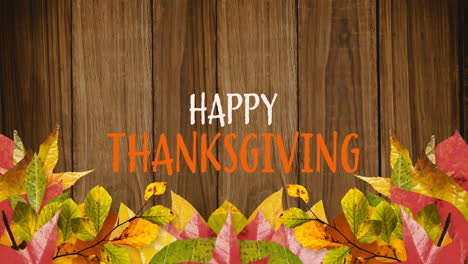 Animation-of-happy-thanksgiving-overautumn-leaves-and-wooden-background