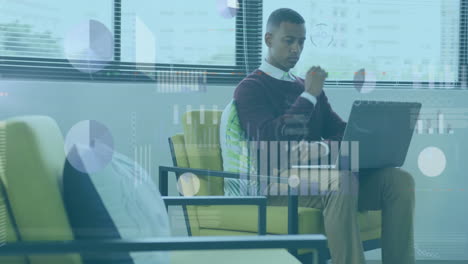 Animation-of-statistical-data-processing-over-thoughtful-african-american-man-using-laptop-at-office