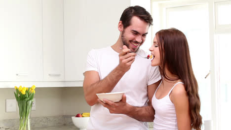 Attractive-couple-eating-cereal-in-the-morning