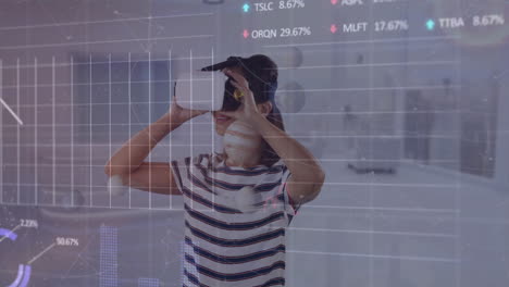 Animation-of-multiple-graphs-and-trading-boards-over-caucasian-girl-using-vr-headset