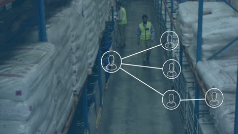 Animation-of-network-of-profile-icons-on-overhead-view-of-biracial-male-worker-walking-at-warehouse