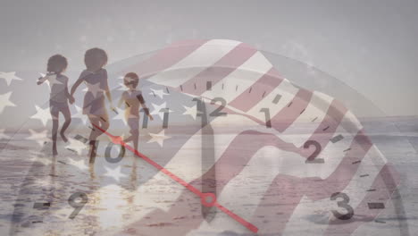 Animation-of-flag-of-america-and-clock-over-african-american-mother-and-children-walking-on-beach